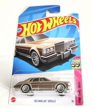 Load image into Gallery viewer, Hot Wheels &#39;82 Cadillac Seville Metallic Gold #75 - 2023 HW: The &#39;80s
